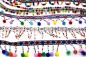 Preview: 1 MTR. PERLENBORTE MIT BOMMELN & INCA WEBBAND BLau/RoT/SILBER