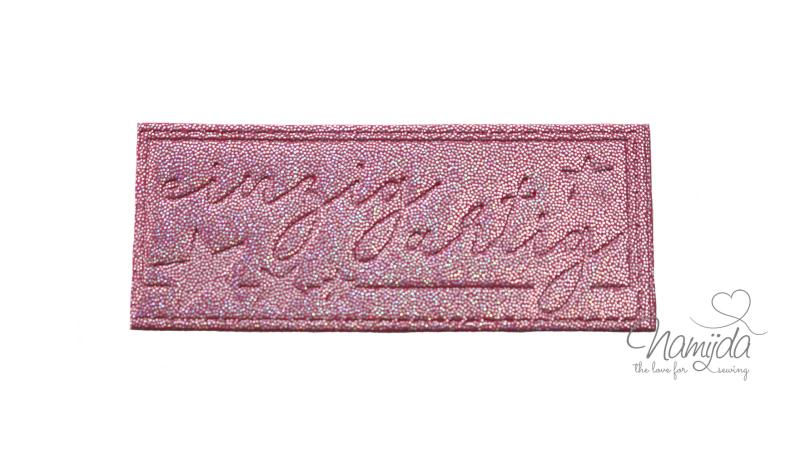 1 Stück - REFLEKTIERENDES LABEL - EINZIGARTIG GLITTER PINK - AUFNÄHER MIT VORGEDRUCKTER NÄHNAHT - 60mm x 25mm